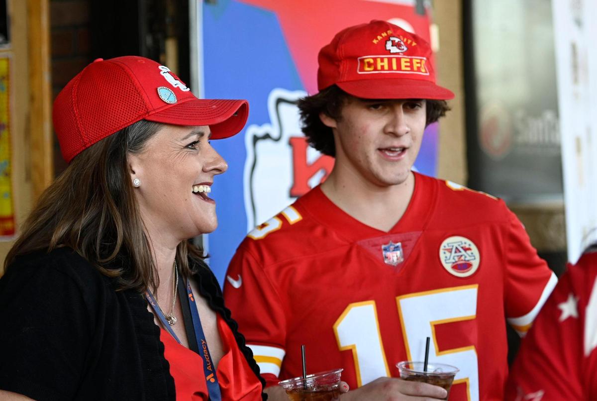 Kansas City radio personality, Dana Wright, shared a laugh with her son, Jack Hegeman, 22, during a visit Wednesday, Feb. 8, 2023, to Pub Rock Live, a Chiefs bar in Scottsdale, Arizona. “We’re very happy to be here,” said Wright. “It’s great to be surrounded by Chiefs fans in another state,” said Hegeman. Wright said they are working on getting tickets to the Super Bowl.