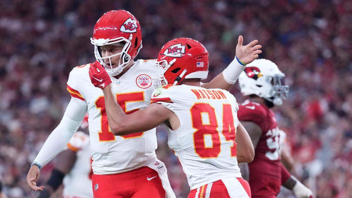 Kansas City Chiefs quarterback Patrick Mahomes (15) and wide receiver Justin Watson (84) celebrate a preseason touchdown against the Arizona Cardinals during the first half at State Farm Stadium on Aug. 19, 2023.