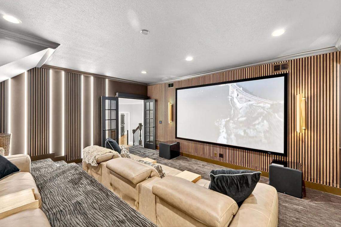 The home has a theater on the bottom floor.