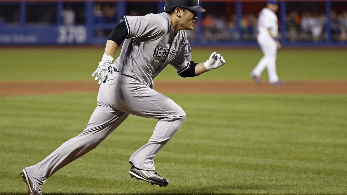 New York Yankees' Masahiro Tanaka runs home to score a run on a sacrifice fly by Yankees' Aaron Judge during the sixth inning of a baseball game against the New York Mets on Friday, June 8, 2018, in New York.