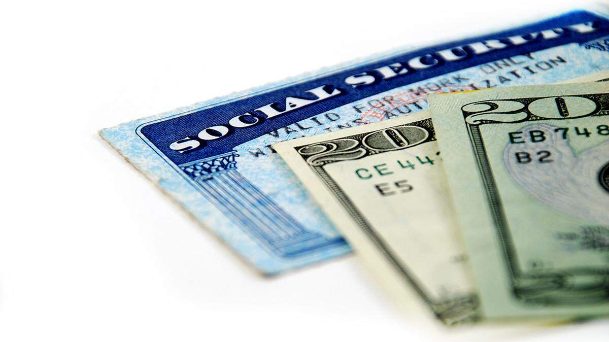 stock pictures of a social security card and money