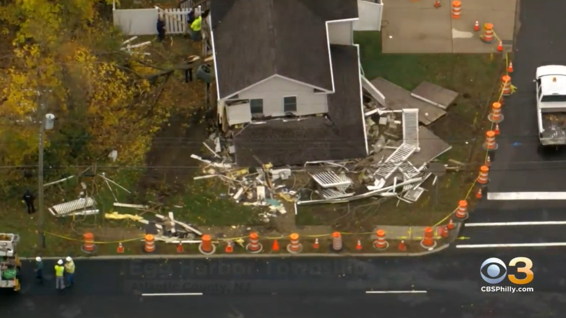 A dump truck went off-road and crashed into a New Jersey home, causing it to partially collapse as the homeower sat inside, according to police in Egg Harbor City.