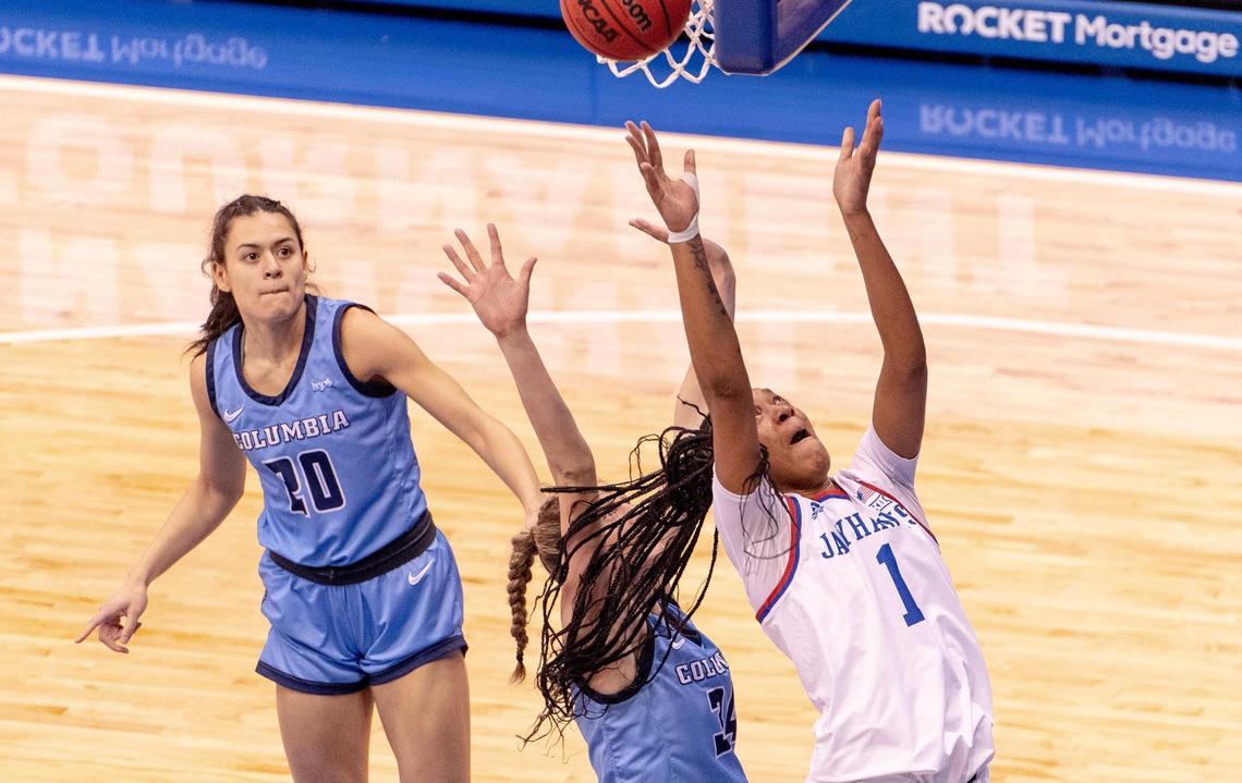 Kansas center Taiyanna Jackson (1) shoots a layup as Columbia guard Paige Lauder (34) defends during the first half of an NCAA college basketball game in the final of the WNIT, Saturday, April 1, 2023, in Lawrence, Kan.