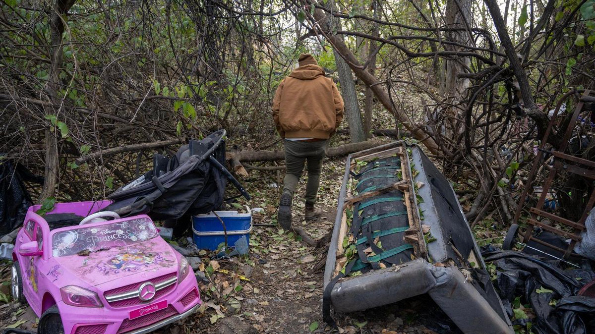 A path between homeless camps among the trees in northeast Kansas City.