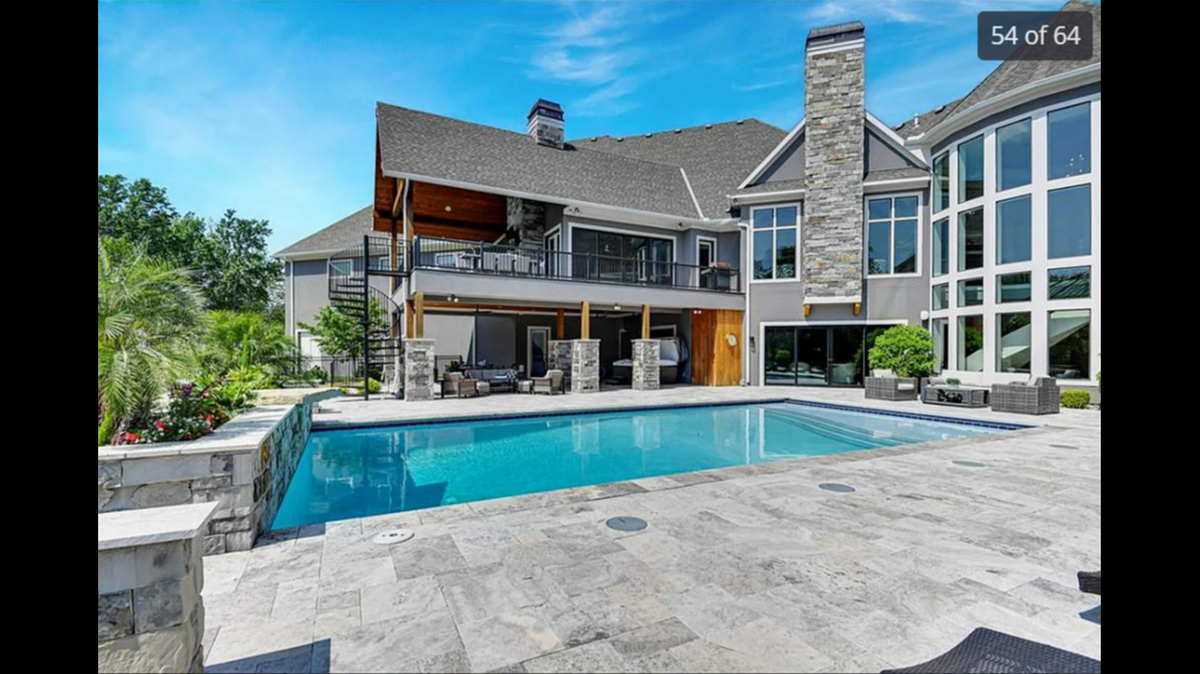 A view of the pool area at 9925 W. 159th St. in Overland Park. The listing on Zillow describes it as a “resort-style backyard oasis with a gunite pool and cascading waterfalls.”