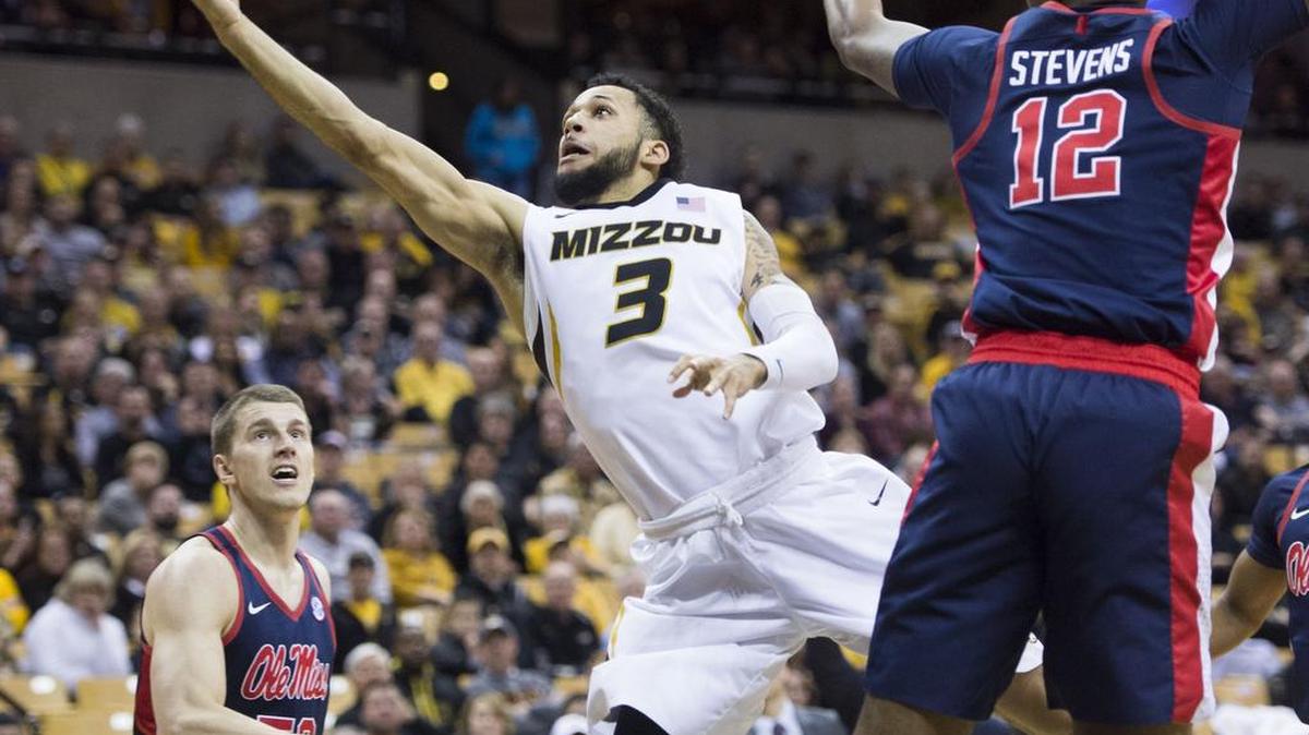 Missouri Tigers guard Kassius Robertson (3) drove past Mississippi Rebels forward Bruce Stevens (12) in the first half during the University of Missouri and University of Mississippi Southeastern Conference basketball game at Mizzou Arena on Tuesday, February 20, 2018, in Columbia, Missouri.