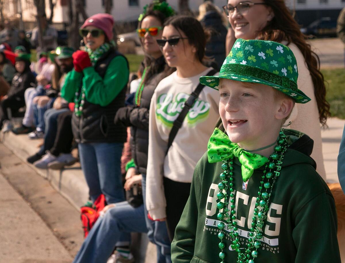 Decked out in his Irish gear, Patrick McCaffery, 10 of Shawnee, watched as the parade headed south on Broadway Boulevard Sunday, March 17th, 2024, during the 50th annual St. Patrick’s Day parade.