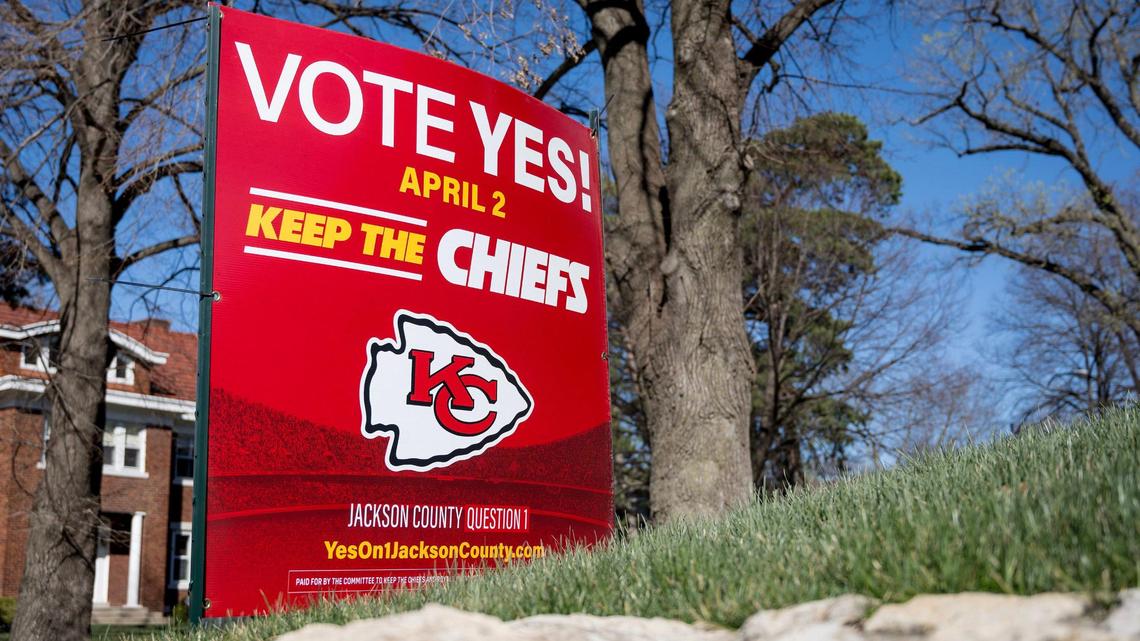 A Kansas City yard sign urges voters to support a ballot measure to approve a 40-year sales tax for a new Royals stadium and improvements to Arrowhead Stadium.