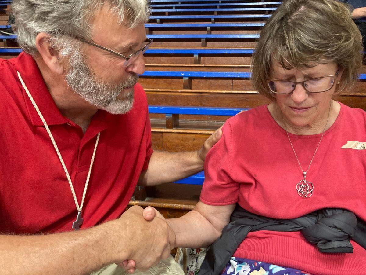The Rev. Richard Casady comforted Amtrak passenger Denise Mai, 67, of Ponca City, Oklahoma.&nbsp;