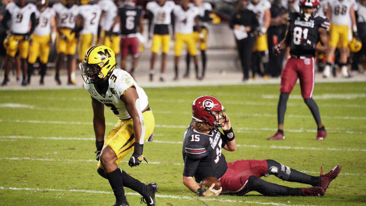 Missouri safety Martez Manuel (3) celebrates a sack of South Carolina quarterback Collin Hill (15) during the first half of an NCAA college football game Saturday, Nov. 21, 2020, in Columbia, S.C. (AP Photo/Sean Rayford)