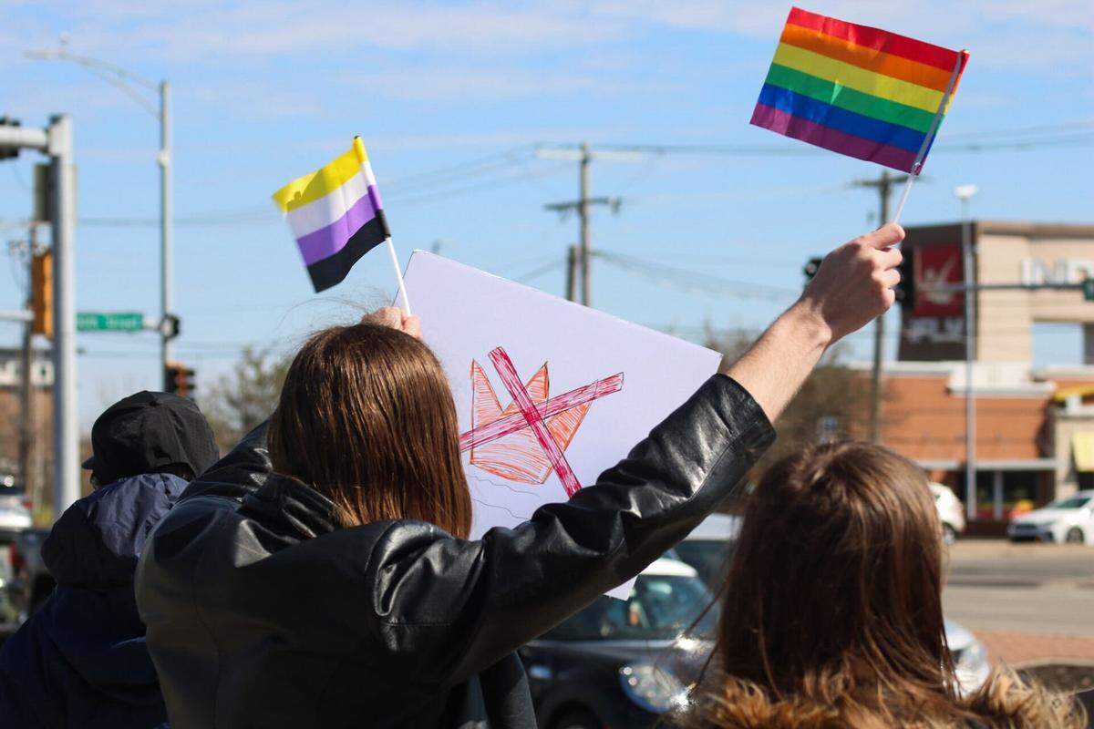Protesters gather near 110th Street and Metcalf Avenue in Overland Park for the No Kings rally March 28, 2026.