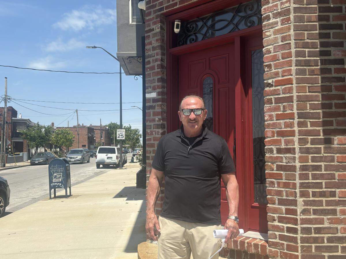 John Strada stands on the corner of Pacific Avenue and Troost Avenue, now a part of the newly redrawn 6th Congressional District.