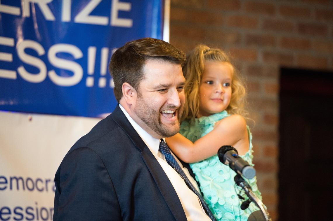 Democratic candidate Brent Welder, who finished second to Sharice Davids, said he would give her his full support in the general election. He held his daughter at a unity rally Wednesday in Kansas City, Kan.