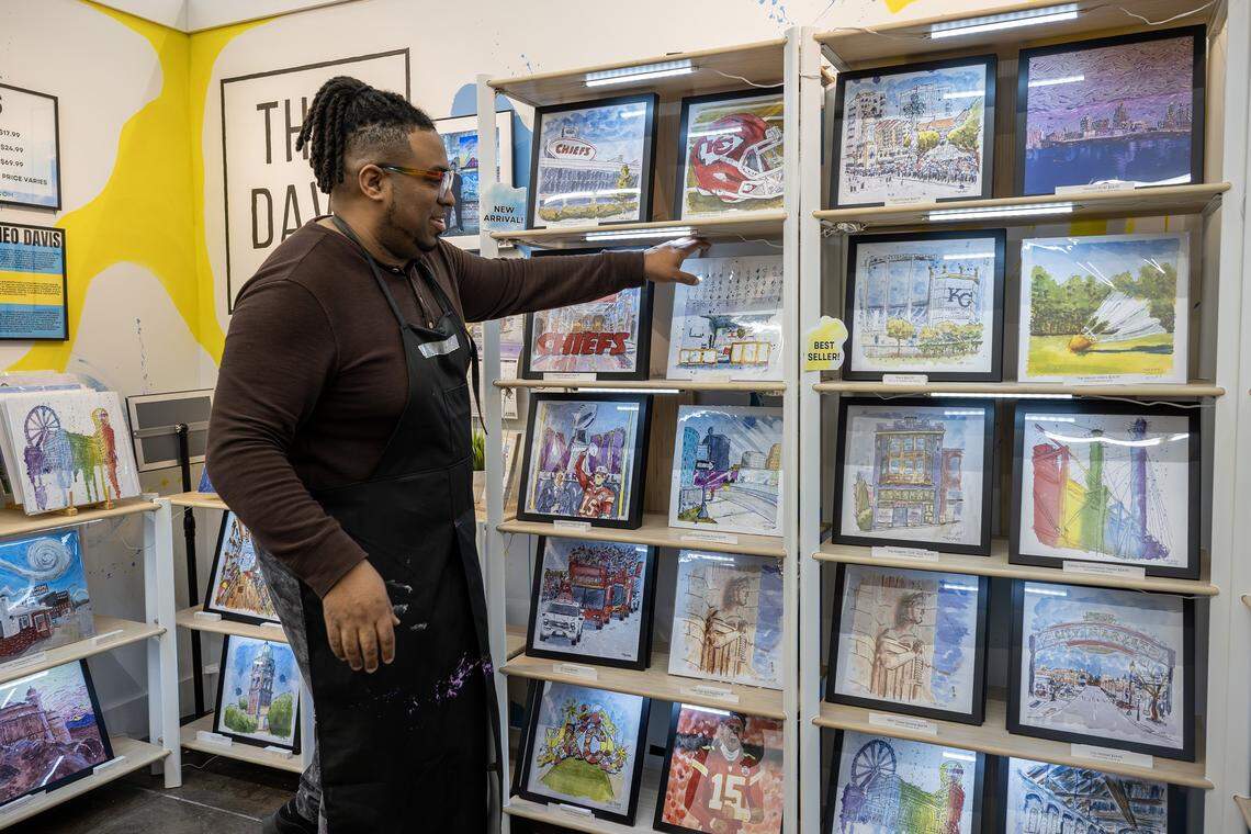Artist Theo Davis discusses his artwork at his booth inside Painted Tree on Tuesday, Dec. 16, 2025, in Kansas City.