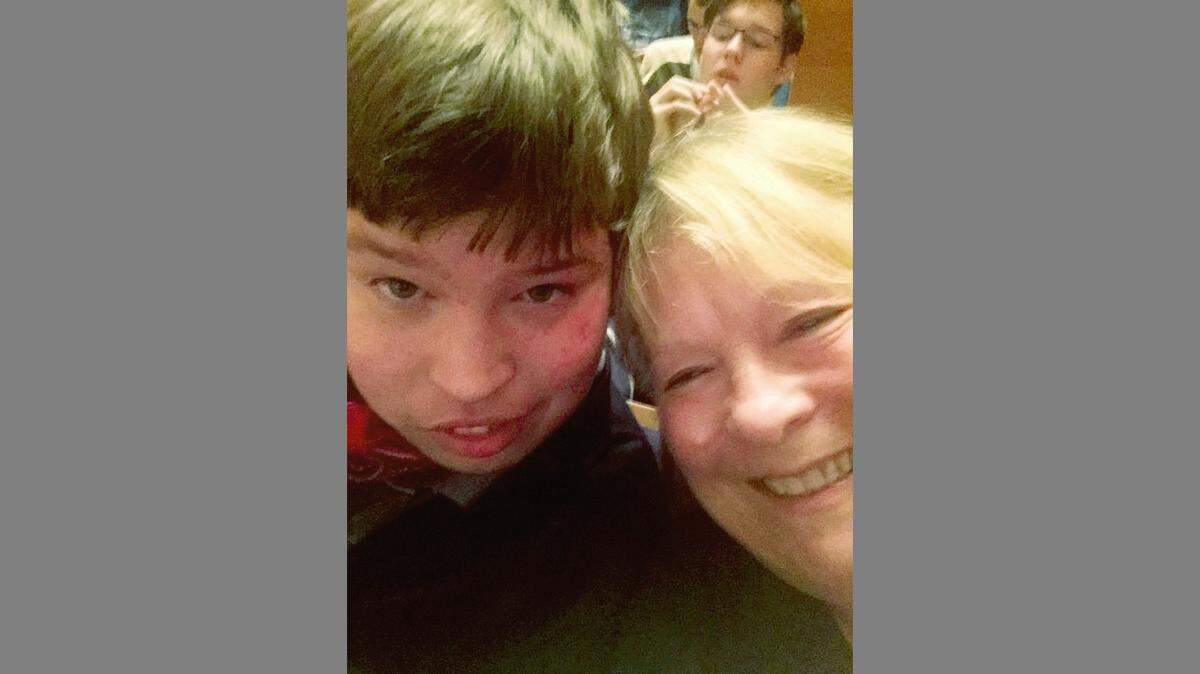 Sam Burnes and his mom, Debra Skodack Burnes, at a Kansas City Symphony sensory-friendly concert, his first time in Helzberg Hall. Loved ones donated money to the program in his memory.