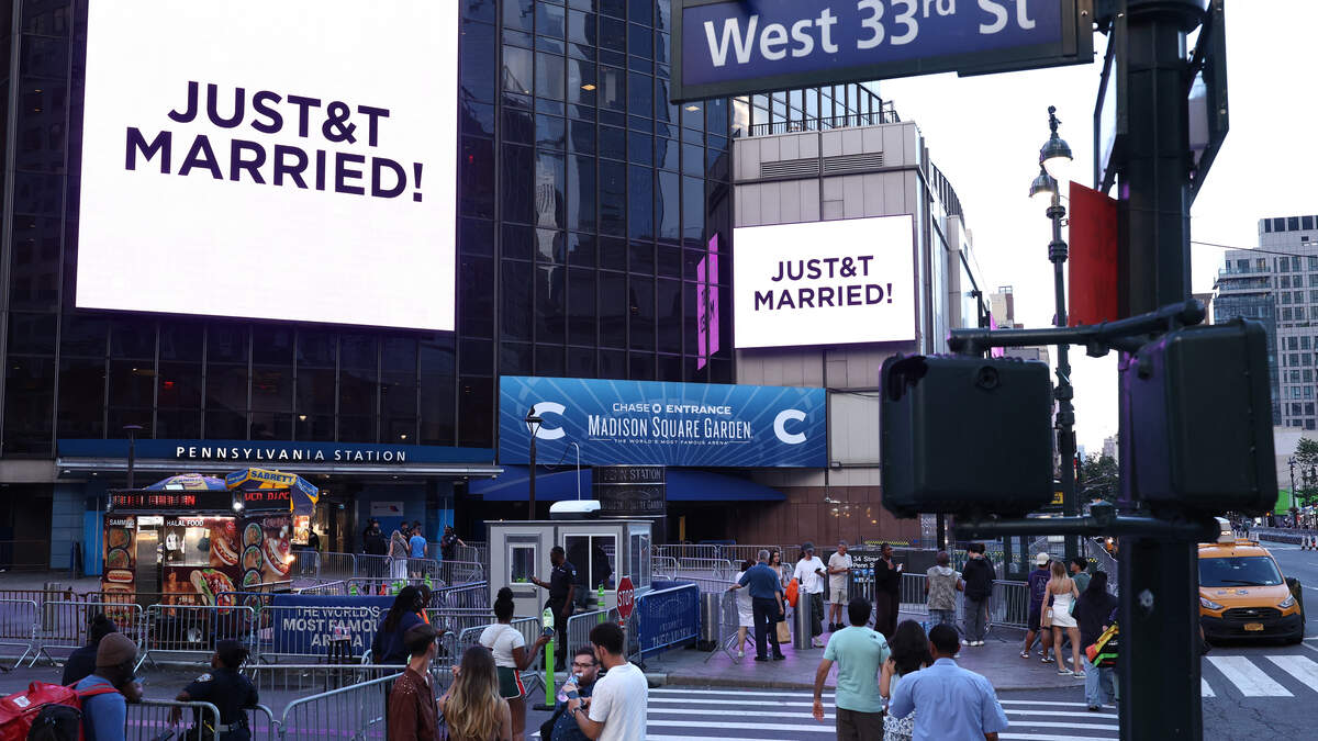 Photo: Kansas City Star A giant screen shows the message "JUST&T MARRIED!" (T&T for Taylor and Travis) outside Madison Square Garden, the reported