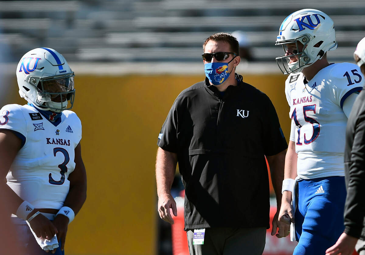 Kansas’ acting head coach Joshua Eargle watches before an NCAA college football game against West Virginia, Saturday, Oct. 17, 2020, in Morgantown W.Va. (William Wotring/The Dominion-Post via AP)