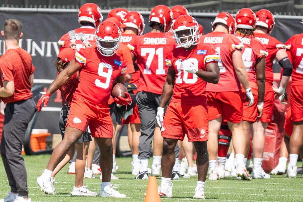 Kansas City Chiefs running back Kenneth Walker breaks down a drill with rookie running back Emmett Johnson on the first day of minicamp, Tuesday, June 9, 2026, in Kansas City.