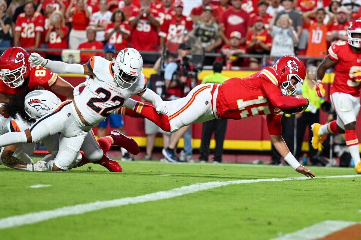 Kansas City Chiefs quarterback Patrick Mahomes (15) dives to score a touchdown in the first quarter of the Kansas City Chiefs vs. Denver Broncos NFL season opener at Arrowhead Stadium in Kansas City on Sept. 14, 2026.