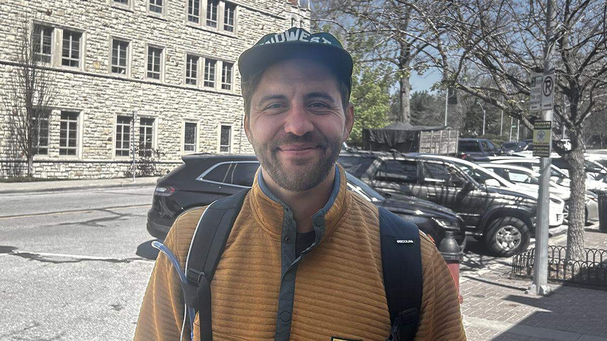 Chad Grittman, 30 miles into a 45-mile walk spanning the length of Kansas City on Monday. Grittman is running to represent the 6th District At-Large on the City Council next year.