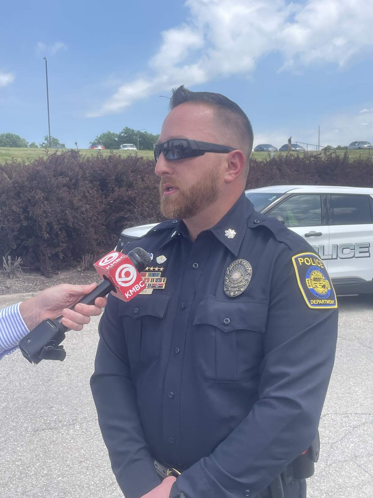 Syler Colaço, deputy police chief of the Kansas City, Kansas Public Schools Police Department, addresses media following his pre-termination hearing on the morning of June 3, 2026, outside the district’s central office.