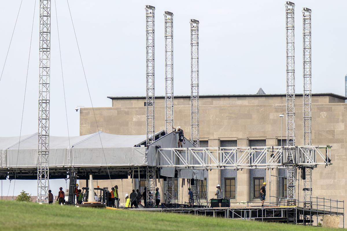 Event staffers set up a stage outside the National WWI Museum and Memorial on Tuesday, Sept. 30, 2025, in Kansas City, ahead of pop singer Chappell Roan's concert Visions of Damsels and Other Dangerous Things.