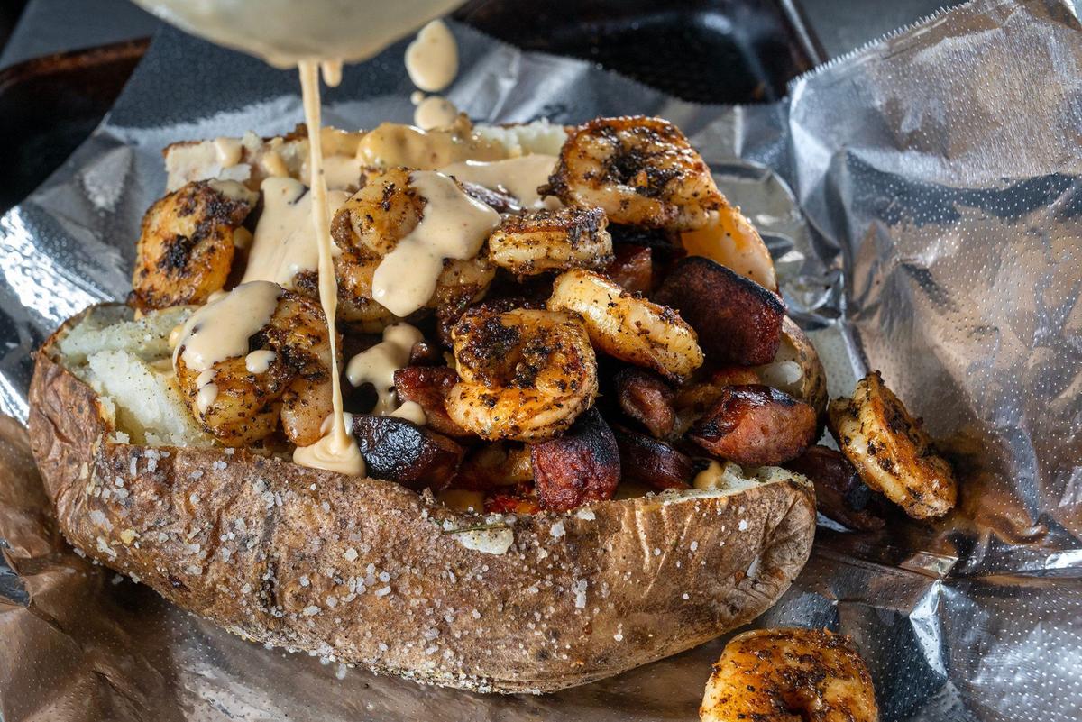 Thomas Clark’s loaded baked potatoes include the NOLA, which features a Cajun cream sauce on a baked potato topped with crawfish, shrimp, andouille sausage and green onions.