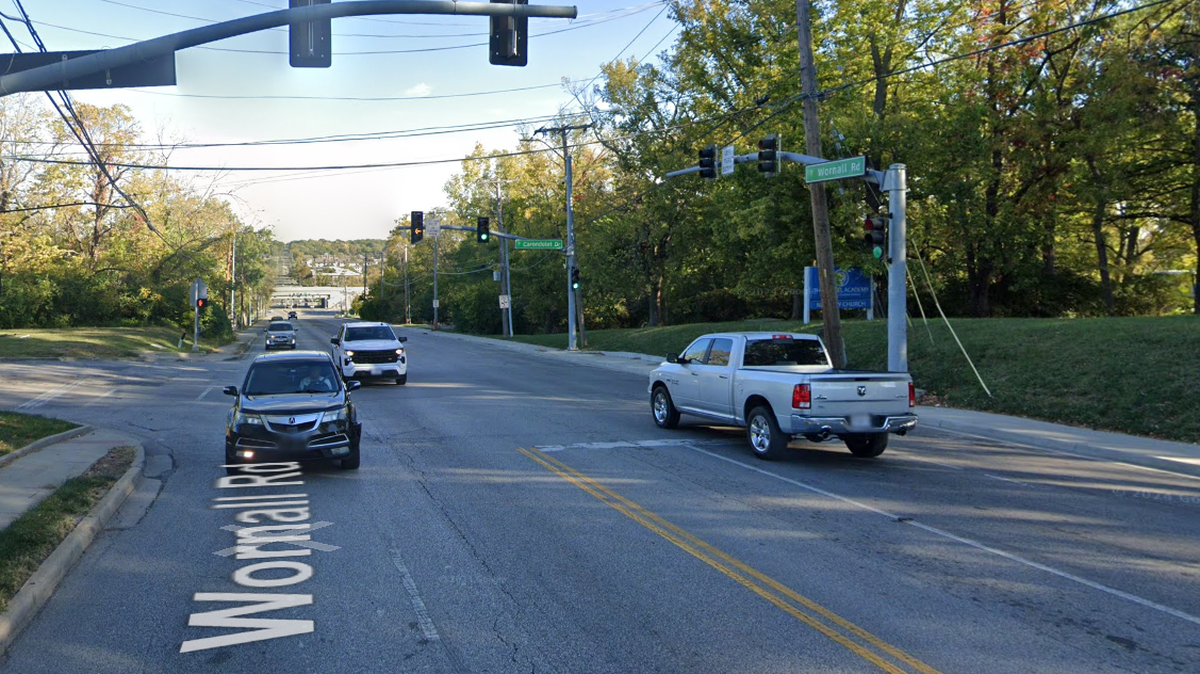 According to Kansas City police, a black Chrysler 300 and a silver Dodge Charger were allegedly street racing southbound on Wornall when the Chrysler struck a silver Honda HRV that was turning left onto Carondelet Drive. The driver and passenger of the Honda were pronounced dead at the scene. This is a Google Maps street view image from October. 