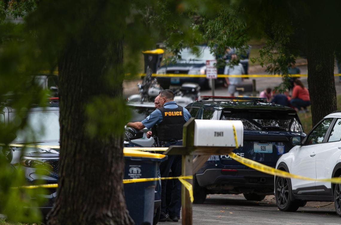 Police talk with each other at the scene of a potential homicide on the 7900 block of N. Forest Avenue on Friday, Sept. 22, 2023, in Kansas City. The investigating is being handled as a homicide after investigators found a deceased adult female inside of a home with bodily trauma, police said.