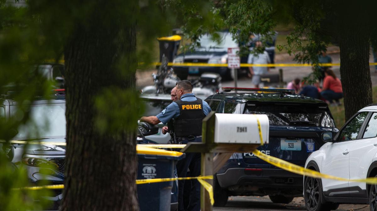 Police talk with each other at the scene of a potential homicide on the 7900 block of N. Forest Avenue on Friday, Sept. 22, 2023, in Kansas City. The investigating is being handled as a homicide after investigators found a deceased adult female inside of a home with bodily trauma, police said.