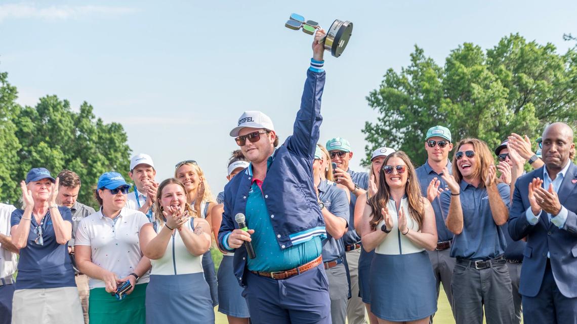 Harry Higgs won the AdventHealth Championship golf tournament at Blue Hills Country Club on Sunday, May 19, 2024, in Kansas City. Mayor Quinton Lucas, right, presented him with the tournament’s blue jacket.