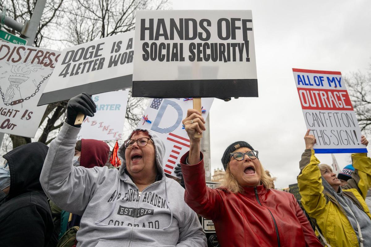 Protesters expressed their views during a rally called Hands Off! Kansas City Fights Back, a peaceful pro-democracy rally that takes aim at Elon Musk and the Trump administration’s policies on Saturday, April 5, on the Country Club Plaza in Kansas City.