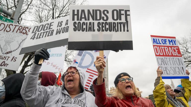 Hundreds crowd KC’s Plaza for ‘Hands Off!’ protest against Trump, Elon Musk