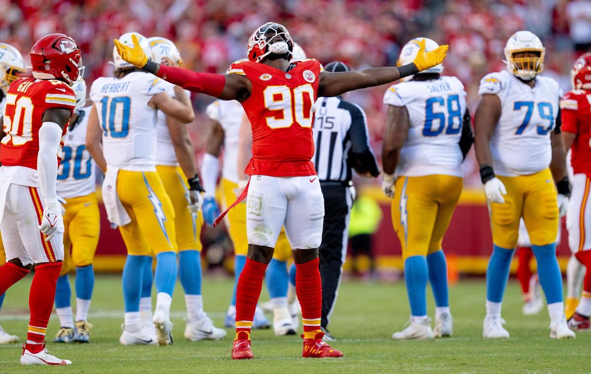 Kansas City Chiefs defensive end Charles Omenihu (90) celebrates a sack during an NFL football game against the Los Angeles Chargers at GEHA Field at Arrowhead Stadium on Sunday, Oct. 22, 2023, in Kansas City.