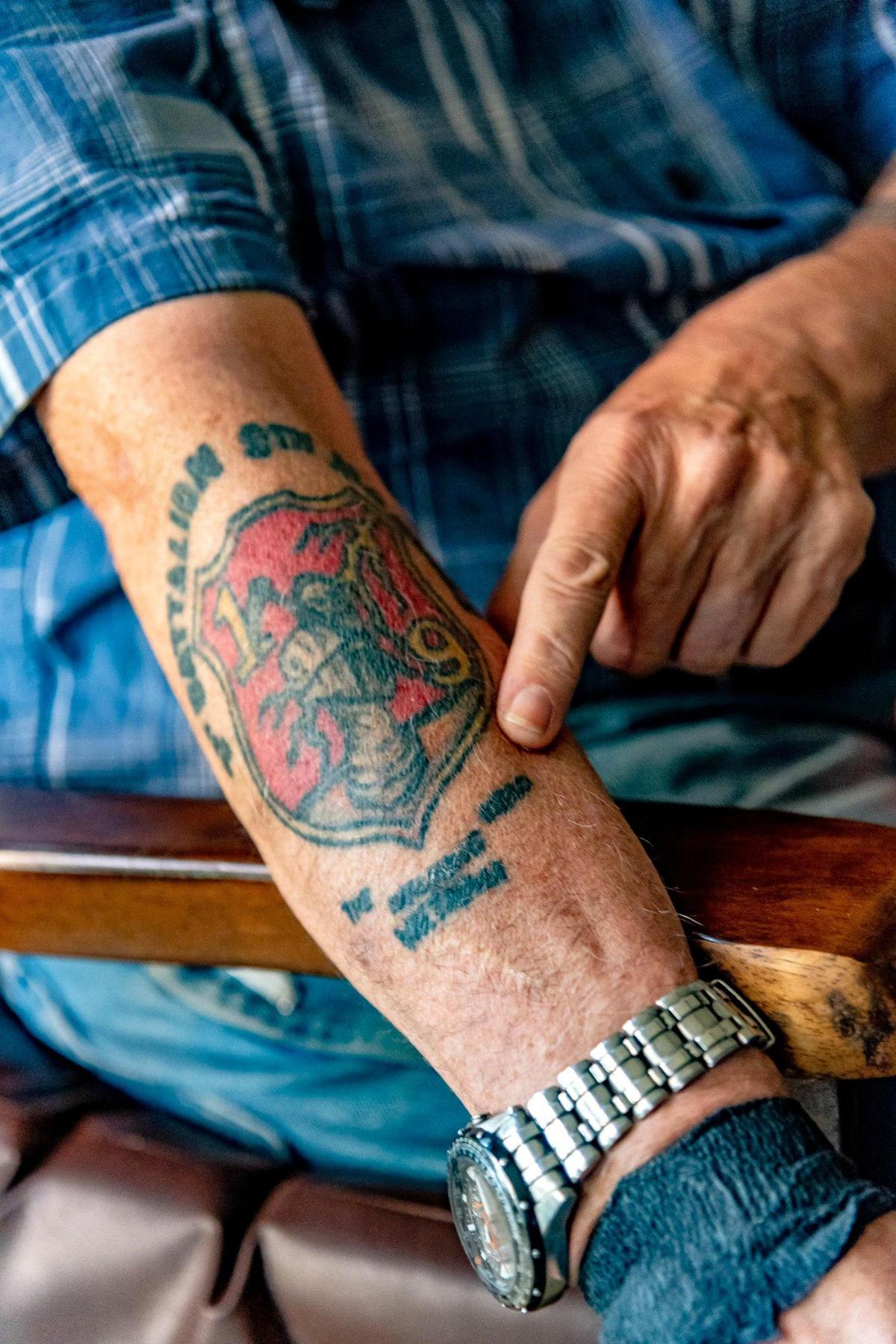 Vietnam veteran John Musgrave’s tattoo pays tribute to his Marine outfit.