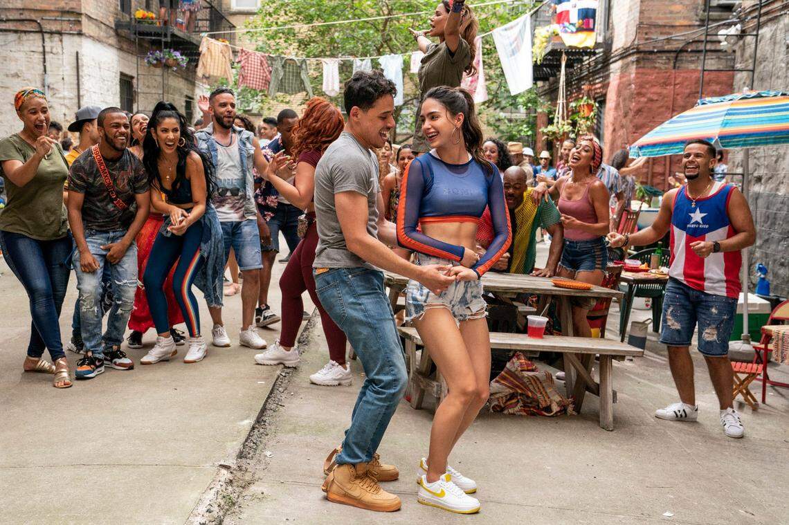 In the musical “In the Heights,” Usnavi (Anthony Ramos) secretly pines for Vanessa (Melissa Barrera).