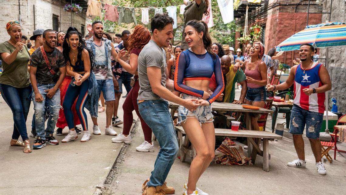 In the musical “In the Heights,” Usnavi (Anthony Ramos) secretly pines for Vanessa (Melissa Barrera).