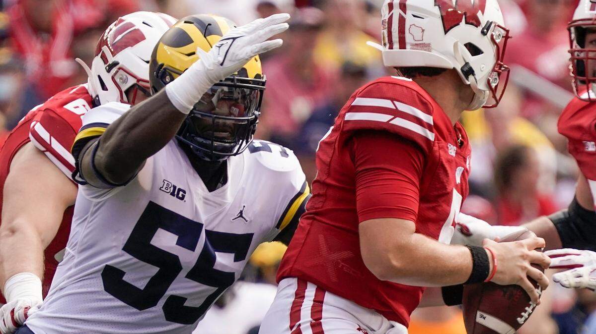 Michigan’s David Ojabo sacks Wisconsin’s Graham Mertz during the first half of an NCAA college football game Saturday, Oct. 2, 2021, in Madison, Wis. (AP Photo/Morry Gash)