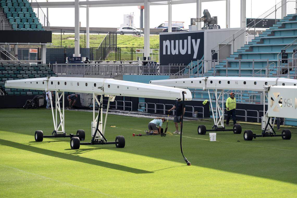 Crews lay sod over turf to convert the field for rugby at CPKC Stadium on Tuesday, April 14, 2026, in Kansas City.