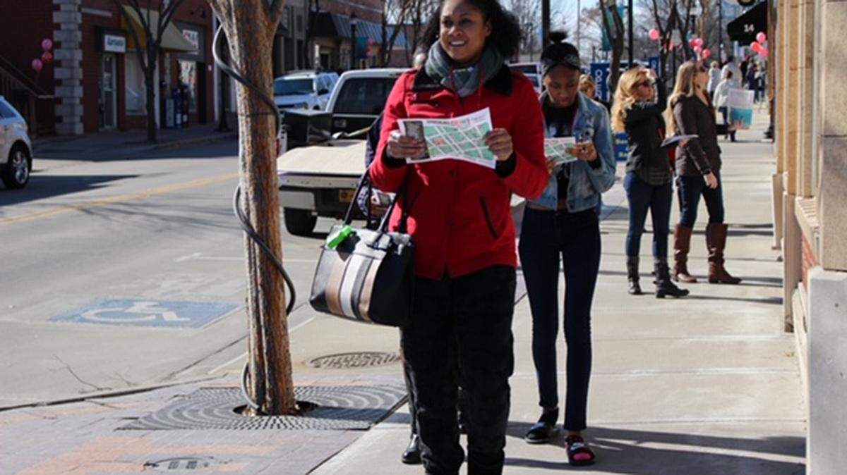 Shoppers picked up their chocolate bar and map. They are on their way to explore deals in Downtown Lee’s Summit during the Chocolate Crawl for a Cause in 2018.