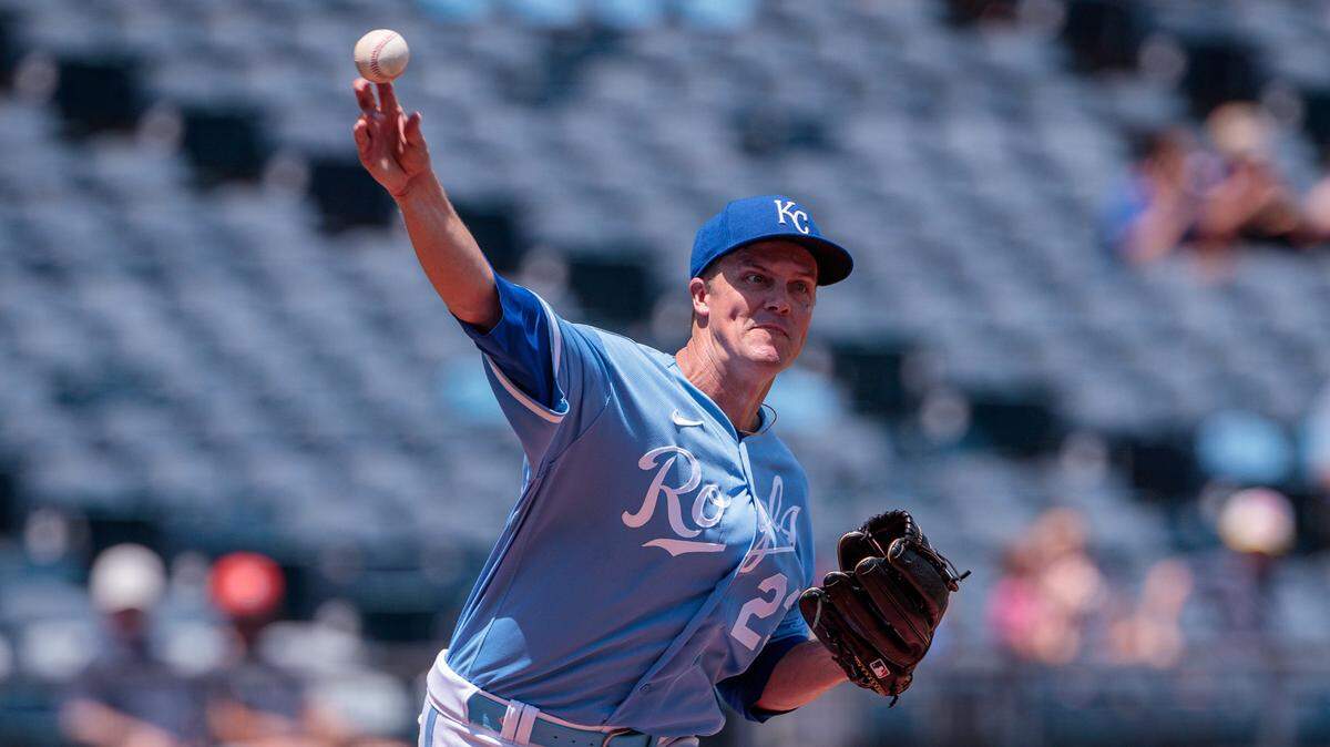 Kansas City Royals starting pitcher Zack Greinke (23) throws to first base during the second inning against the Cleveland Guardians at Kauffman Stadium.