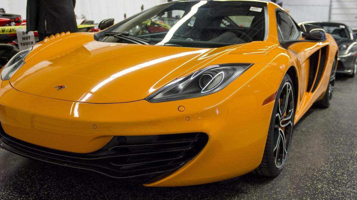 Expensive cars and other items that may indicate someone is living beyond their means may be warning signs that that person is living off of embezzled funds.