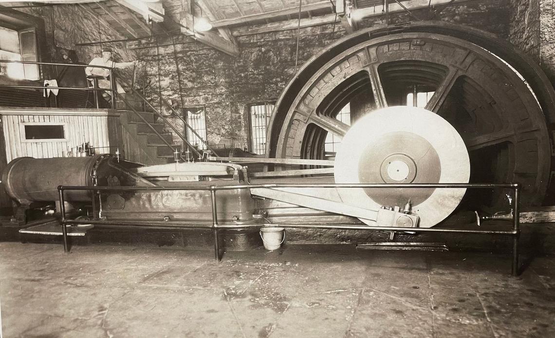 A former prison employee, hoisting engineer Frank Young of Lansing, is seen working in this 1930 photo operating the coal mine shaft hoist in the Kansas State Penitentiary that carried inmates up and down a 750-foot-deep shaft to extract coal from a mine under the facility. Coal was also carried up by the hoist. Frank Young’s father was also a hoisting engineer at the prison.