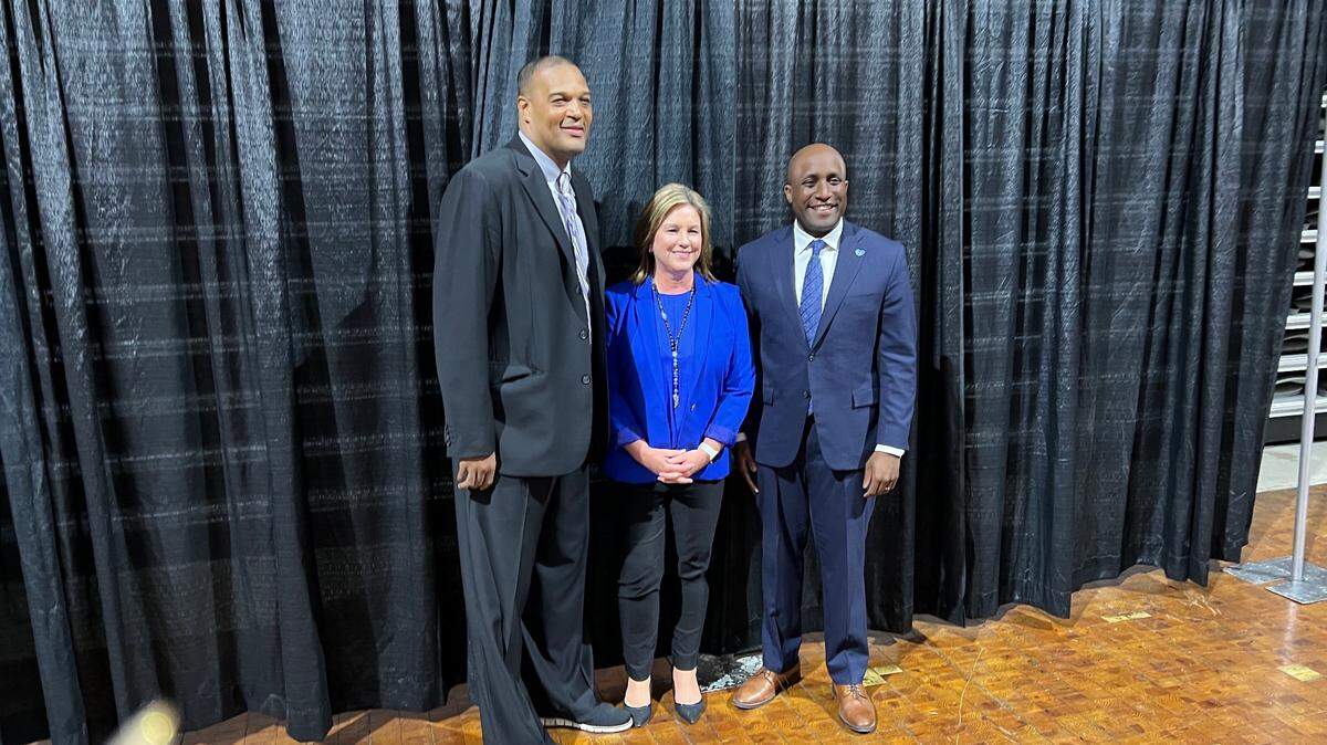 Daimon Beathea (left) who is bringing international basketball events to Municipal Auditorium this summer and summers to follow through 2027, attended a news conference Tuesday with Kathy Nelson, head of the KC Sports Commission and Kansas City Mayor Quinton Lucas.