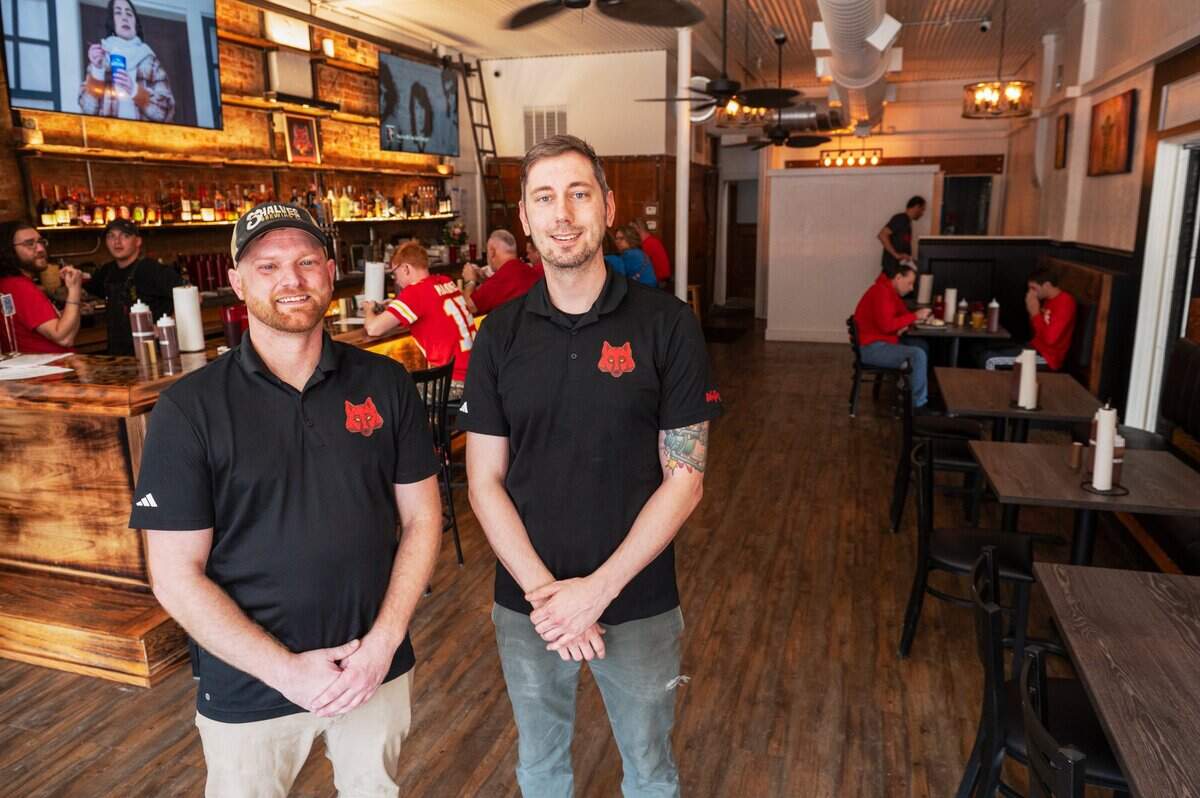 Jared Wolfe, left, and Sam Parker, owners of Wolfepack BBQ, which now has a brick-and-mortar location at 910 E. Fifth​ St.
