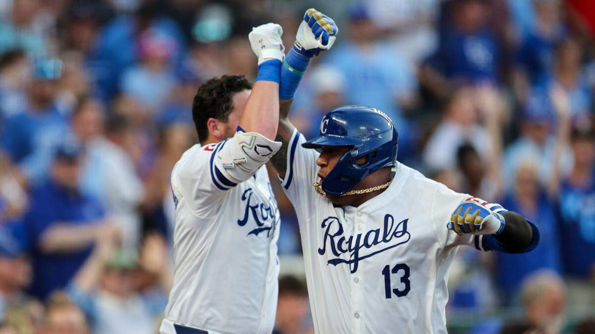 Kansas City Royals catcher Salvador Perez bumps arms with first baseman Vinnie Pasquantino after their back-to-back home runs in the fourth inning of Monday’s game against the Miami Marlins at Kauffman Stadium.