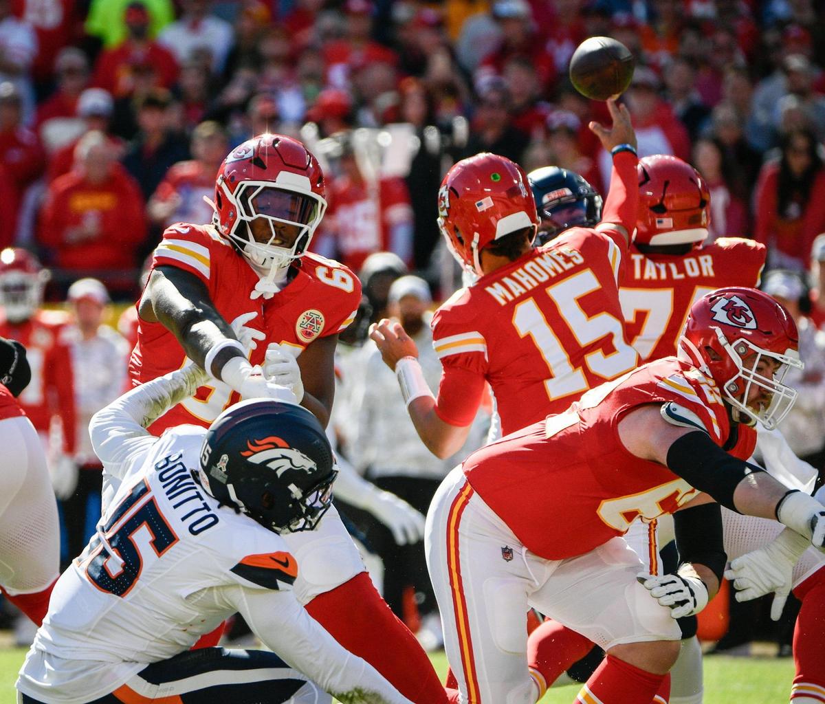 Kansas City Chiefs offensive tackle Wanya Morris (64) fends off Denver Broncos linebacker Nik Bonitto (15) on Sunday, Nov. 10, 2024, at GEHA Field at Arrowhead Stadium.