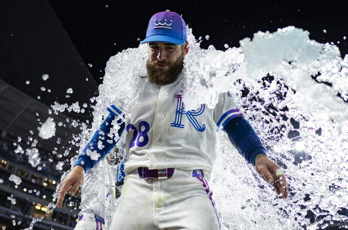 Royals outfielder Kyle Isbel is doused in celebration by teammates Bobby Witt Jr. and Nick Loftin after Isbel’s walkoff single lifted KC to victory over the Detroit Tigers at Kauffman Stadium in Kansas City on Friday, May 8, 2026.