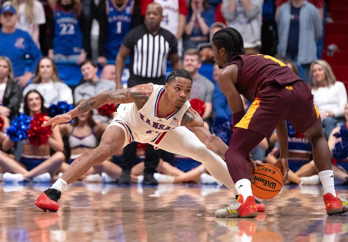 Kansas Jayhawks guard Shakeel Moore (No. 0) has his eye on Arizona State Sun Devils guard Alston Mason during a college basketball game at Allen Fieldhouse on Wednesday, Jan. 8, 2025, in Lawrence, Kansas.