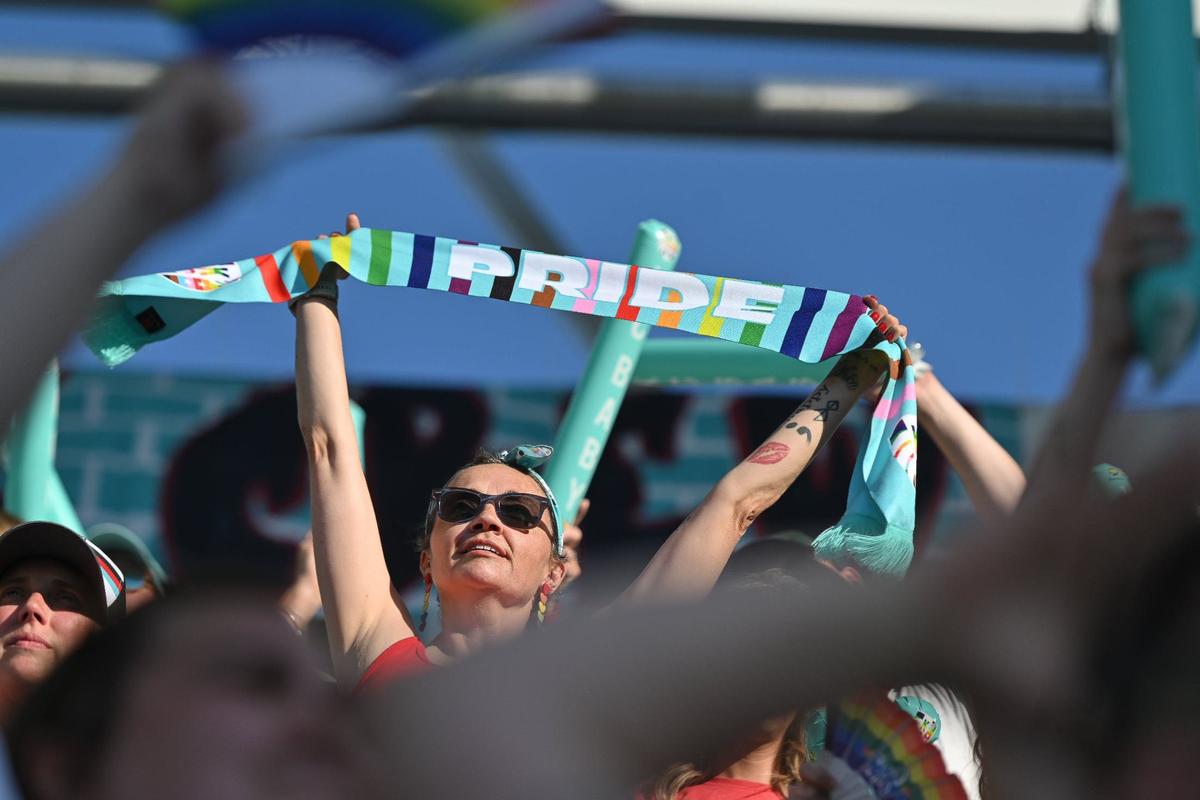 A KC Current fan holds up a specially branded Pride scarf during a match against the Chicago Red Stars on Friday.
